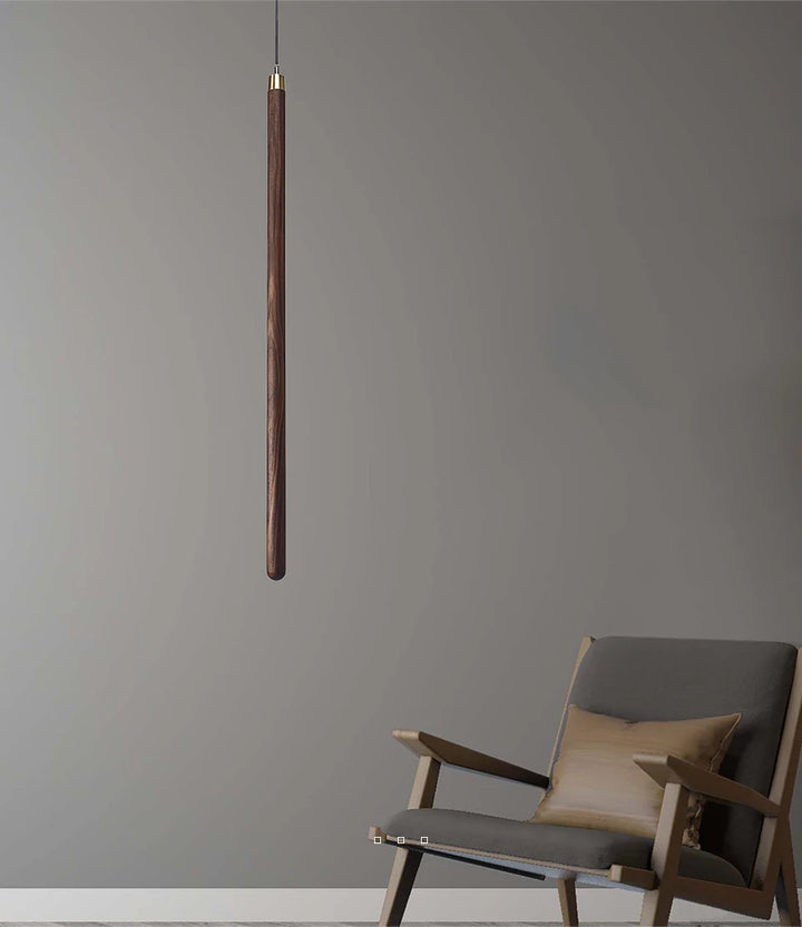 solid wood hanging lamp near chair